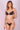 The model is wearing a  Lonarc bikini set Dalia  Black Nude.