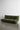 Greta XL Sleeper Sofa in green, featuring a modern low-profile design with tufted cushions, showcased on a polished concrete floor against a plain white wall.