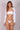 The model is wearing a Lonarc bikini set White