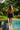  Back view of a Model by the pool in a Lonarc Black cotton beachwear dress