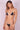 The model is wearing a  Lonarc bikini set Sunny  Black Nude.